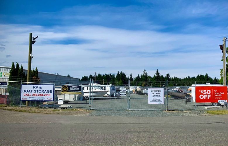 Outdoor Rv & Boat Storage sign, gate and yard for PQ Self Storage in Parksville